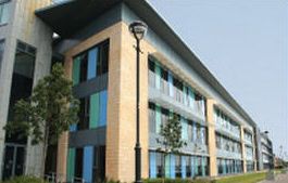 Adams Harrison Litigation Law picture Modern multi-story office building in a business district, Adams Harrison logo visible.